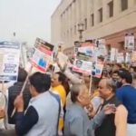 Bjp and Congress mp's protests outside Parliament